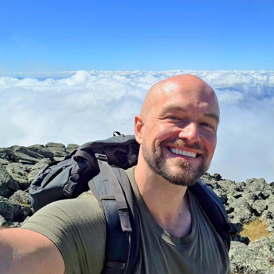 Mr Ryan Connors Growth Marketing Leader Mr Ryan Connors hiking in the mountains